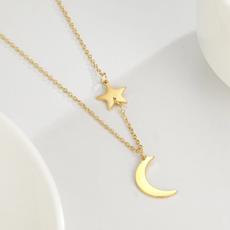 Pendentif lune etoile dore fond blanc